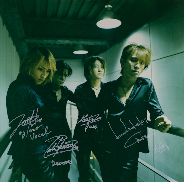Autographed photo by Shocking Lemon band members